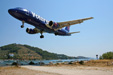 Wide angle shot of a Volare Airbus 320 about to land in Skiathos airport