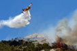 Fire-fighting plane while operating on a mountain fire