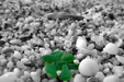 Green sea glass pieces on the Papa Nero beach at Agios Ioannis